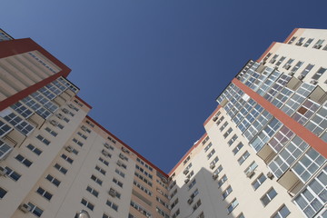 modern building apartments - flats - balcony - windows - blue sky.