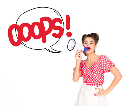 portrait of fashionable young woman in pin up style clothing with oops speech bubble out of loudspeaker isolated on white
