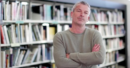 Portrait of mature student in college library