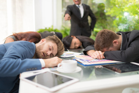 In selective focus of Business people sleeping in the conference room during a meeting.