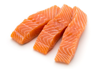 Fresh salmon fillet with basil on the white background.
