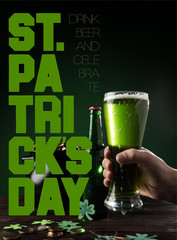 partial view of man with glass of beer and st patricks day lettering