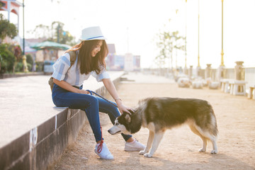 happy woman with pet dog outdoors