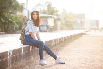 Young beautiful female traveler in the city