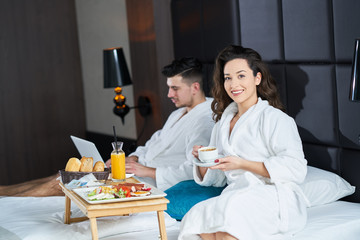 Breakfast in bed, cozy hotel room