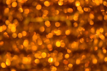 Elegant gold bokeh background for greeting and decorating Christmas and holiday season.