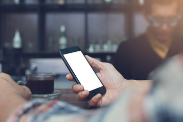 Man using smartphone at coffee shop