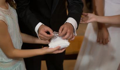 bride and groom holding hands