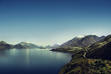 Naklejka premium Picture of a the Lake Wakatipu and some mountains over a blue sky near Glenorchy, in New Zealand. 