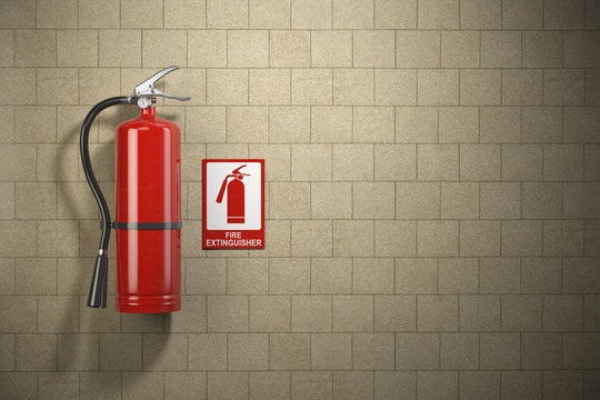 Fire extinguisher with emergency fire sign on the wall background.