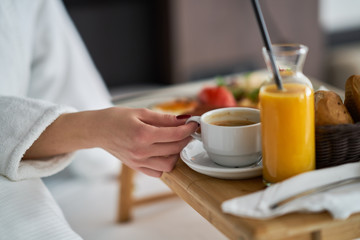 Breakfast in bed, cozy hotel room