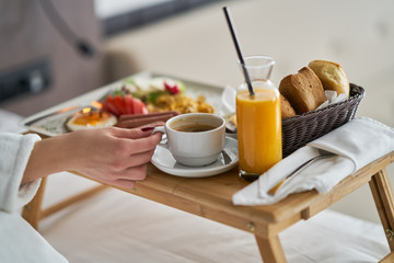 Breakfast in bed, cozy hotel room