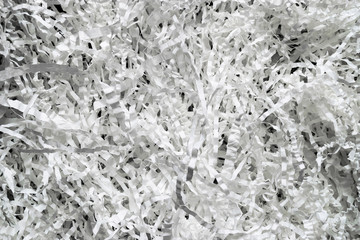 Shredded White Curly Paper Strips Background on Black Background