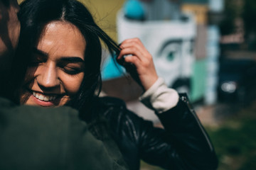 Spring photo session of a beautiful young couple in the old courtyards of the city.