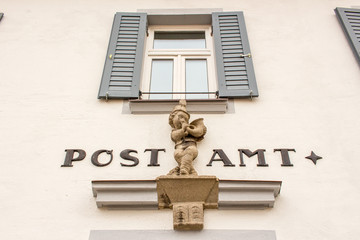 Fototapeta na wymiar Front of an old Post Office Bavaria Germany