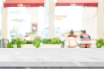 Empty white marble table over blur restaurant background, product and food display montage