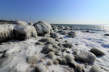 frozen stones by the Baltic Sea coast