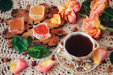 delicious ,colourful retro dessert of marmalade and a Cup of rose hip tea