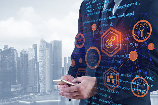Businessman using smartphone with HTML code