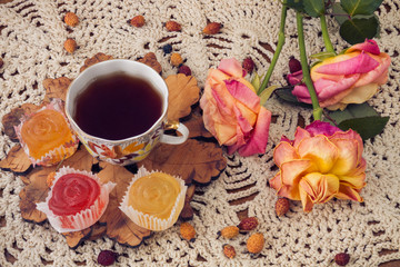 delicious ,colourful retro dessert of marmalade and a Cup of rose hip tea