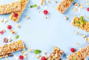 Naklejka na ściany i meble Healthy breakfast and snack concept, homemade granola with fresh raspberries and nuts and granola bars, on bright blue background copy space seamless pattern top view