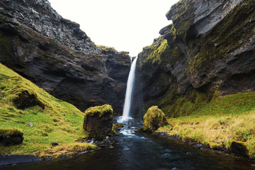Large waterfall coming down from cliff