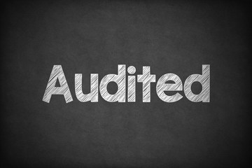 Obraz premium Audited on Textured Blackboard.