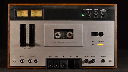 Old cassette player playing music retro style