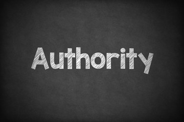 Obraz premium Authority on Textured Blackboard.