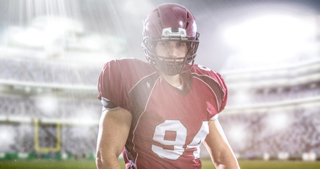 American Football Player isolated on big modern stadium field