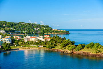 Fototapeta na wymiar Tropical coast on the Caribbean island of St. Lucia. It is a paradise destination with a white sand beach and turquoiuse sea.