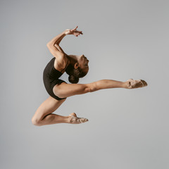 Young gymnast girl stretching and training