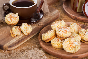 Pile of cinnamon cream cheese coffee cake with a cup of coffee