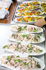 A lot of different salads on the oval plate for a Banquet.