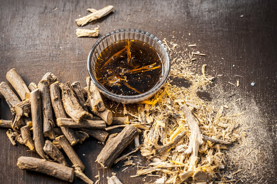 Ayurvedic herb Liquorice root,Licorice root, Mulethi or Glycyrrhiza glabra root and its powder with its tea for detoxifying the body, soothing spasms, easing menstrual cramps, raising blood pressure.