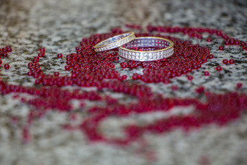 engagement ring on red beads