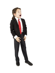 A little long-haired boy in a suit and red tie is surprised