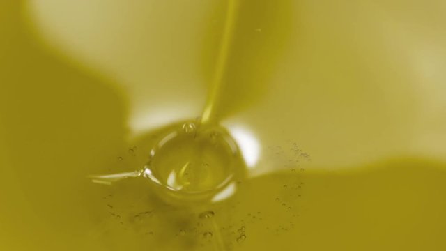 Slow motion pouring olive oil