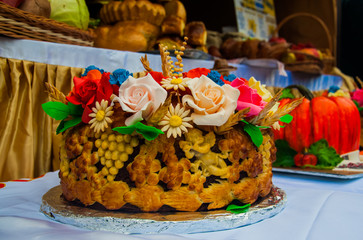Ukrainian traditional loaf decorated with colorful flowers