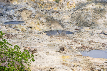 Obraz premium View of Drive-In Volcano Sulphur Springs on the Caribbean island of St. Lucia. La Soufriere Volcano is the only drive-in volcano in the world.