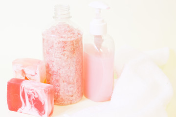 Obraz na płótnie Canvas Aromatherapy spa concept. A glass bowl of orange bath salt, a bar of fruit soap, closeup