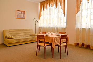  A room interior in warm colors with a picture on a wall