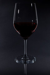 red wine glass isolated on black