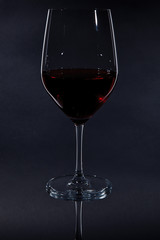 red wine glass isolated on black