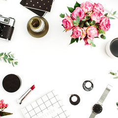Frame made of fashion accessories, cosmetics, rose flowers, photo camera, notebook on white background. Flat lay, top view female blog or website mockup.