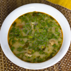 Spicy soup Tom Yam with shrimps and greens