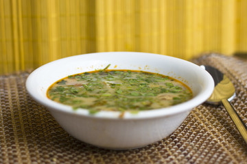 Spicy soup Tom Yam with shrimps and greens
