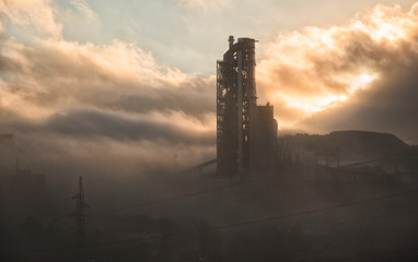 cement plant in fog in the morning