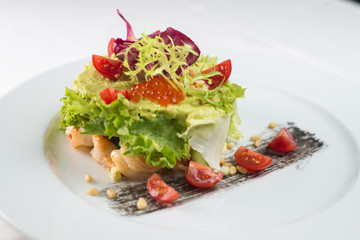Meat dish with vegetables and red caviar