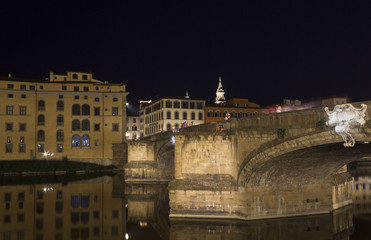 Holy Trinity bridge on Arno river in Florence at night